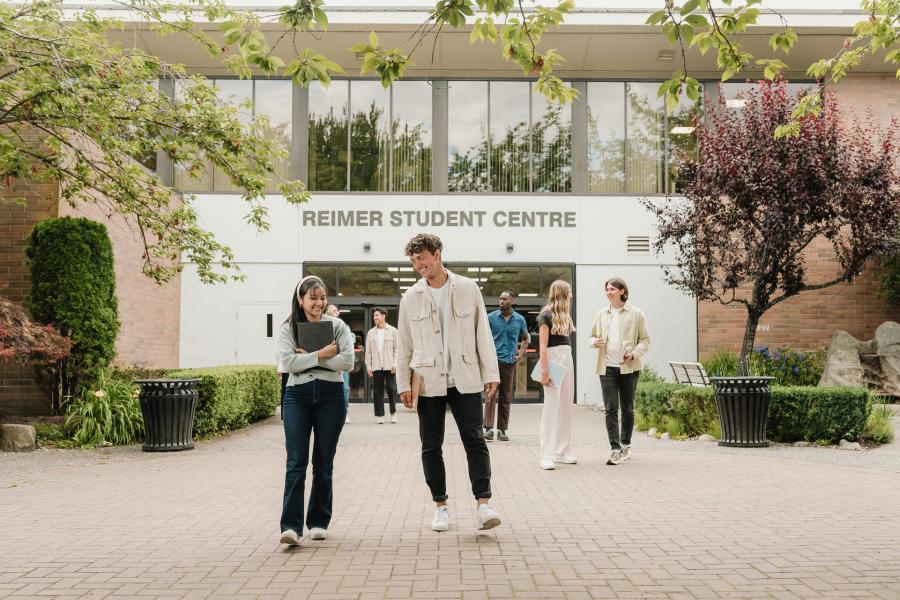 students standing outside in front of Riemer Student Centre