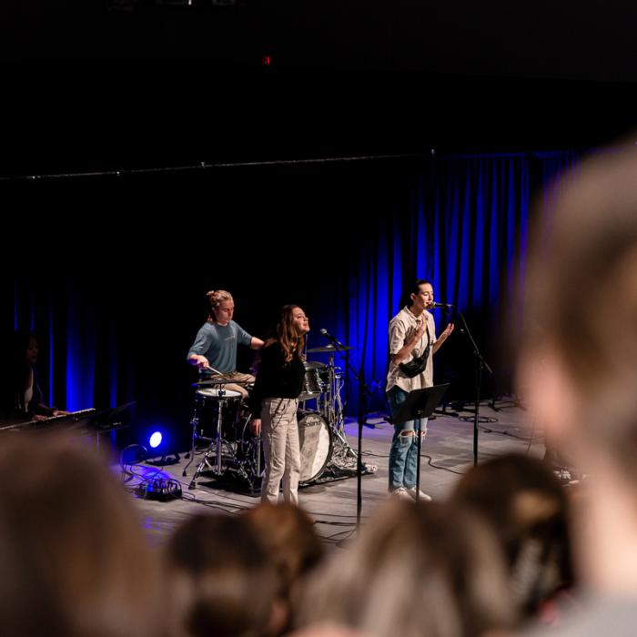 students leading worship for chapel in auditorium