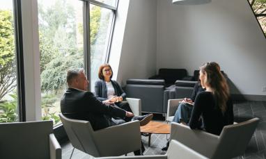 employees chatting in Commons