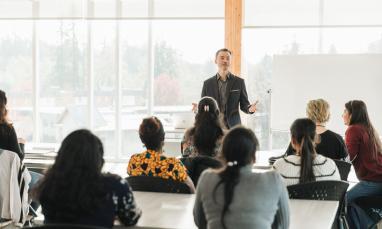 international students in classroom learning from professor