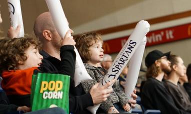 kids cheering on athletics