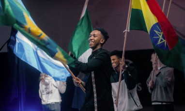 people waving flags from different countries