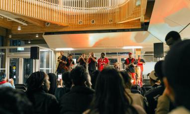 Music group playing with a crowd in Kuhn Centre Atrium 
