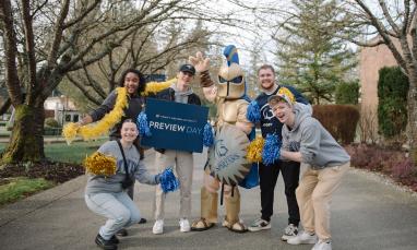 students at preview day smiling with sparty