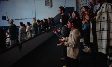 people singing in chapel