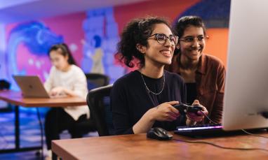 students playing a video game in a lab