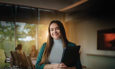 Isabella Alverez standing in Kuhn Centre with a light behind her