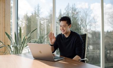 Student attending a virtual session on his computer.
