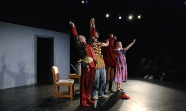 Actors holding hands to bow after a performance.