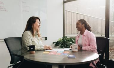Two people in a meeting.