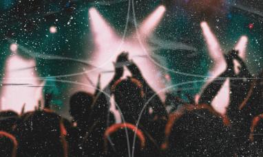 Silhouetted concert crowd with raised hands against bright stage lights, overlaid with a textured grain effect.