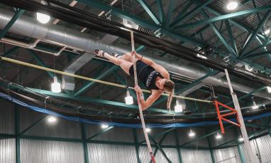 TWU athlete pole vaulting
