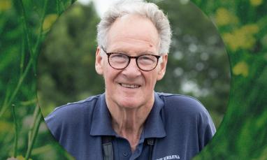 Portrait of Peter Harris surrounded by greenery.