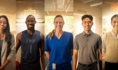 Five diverse people standing indoors, smiling warmly at the camera.