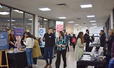 People walking down the hallway at Career Fair