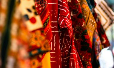 African textiles hanging from a beam