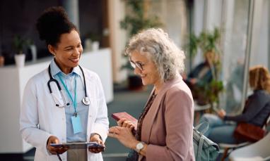 Happy senior woman going through her medical data