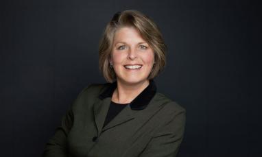 Headshot of Dr. Rosemary Flaaten in front of a black background