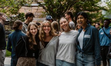Students posing together outdoors during Orientation.