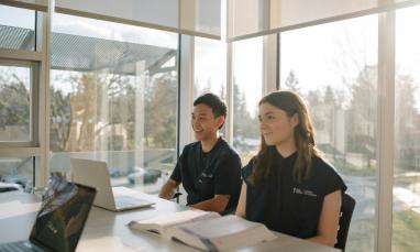 two school of nursing students in a classroom studying