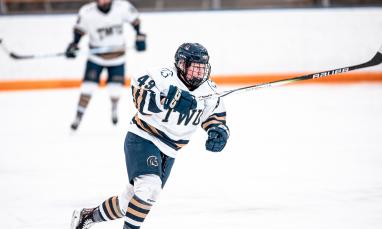 TWU student playing hockey 