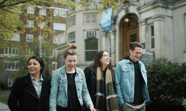 Four students walking in Ottawa at the Laurentian Leadership Centre (LLC).