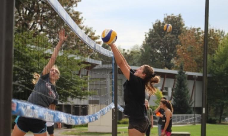 students playing volleyball