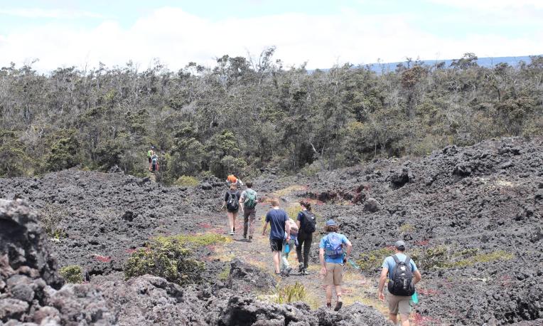 students hiking outside