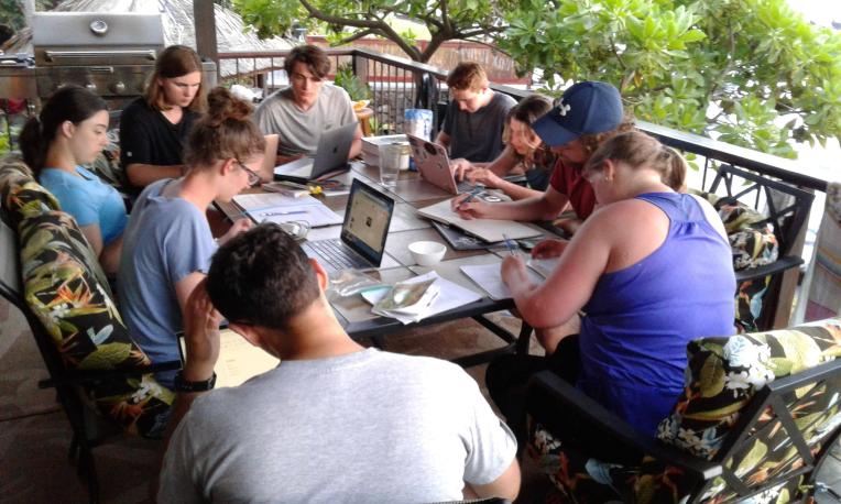 students working on deck