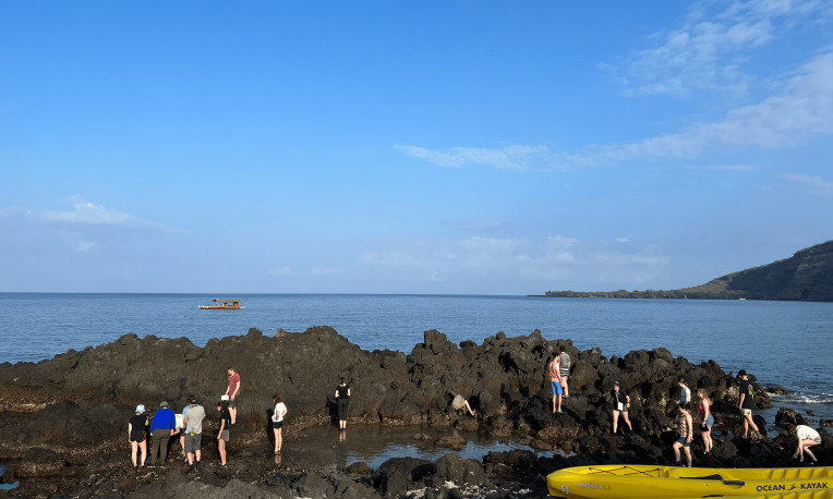 students walking on rocks
