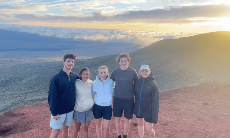 students taking a group photo on mountain