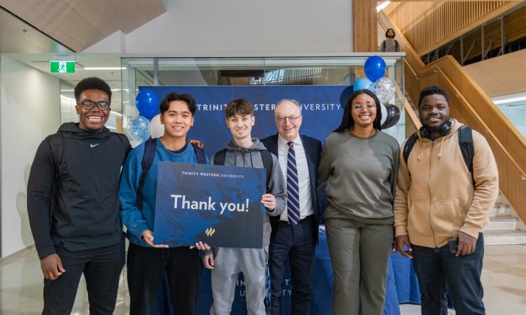 students with thank you sign