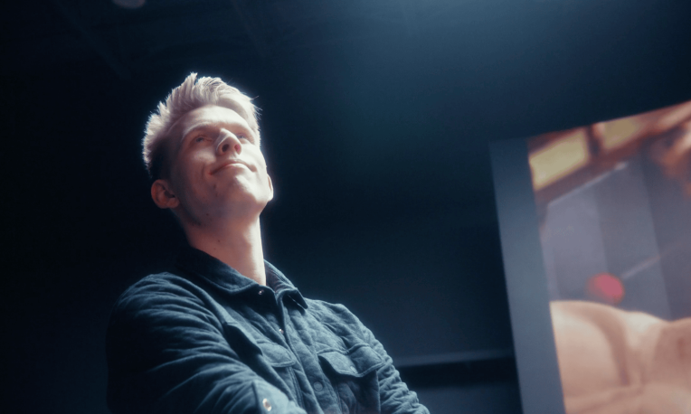 spencer funk standing in front of screen