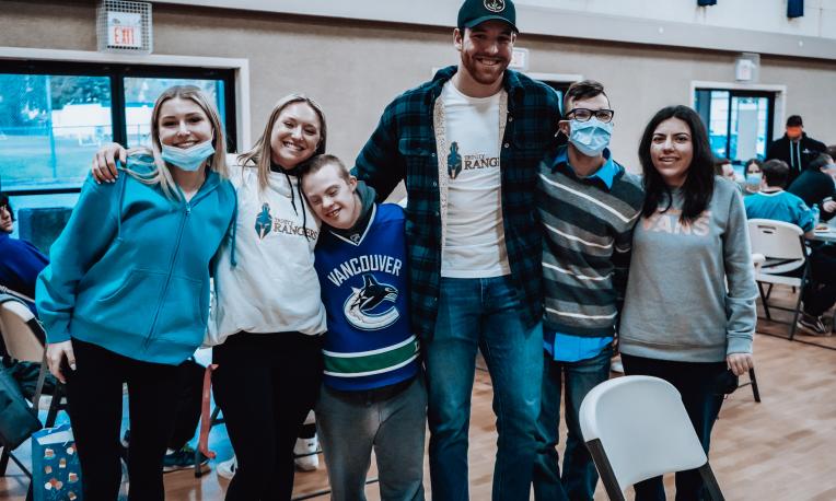 6 people smiling at the camera