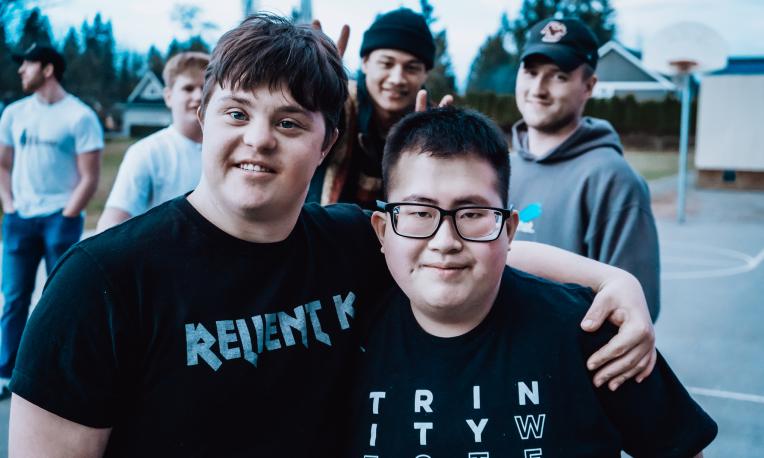 Two people smiling at the camera.