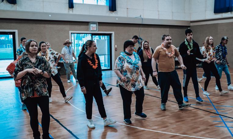 Group of people dancing in rows