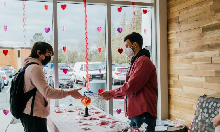 Person making a purchase at a fundraiser.