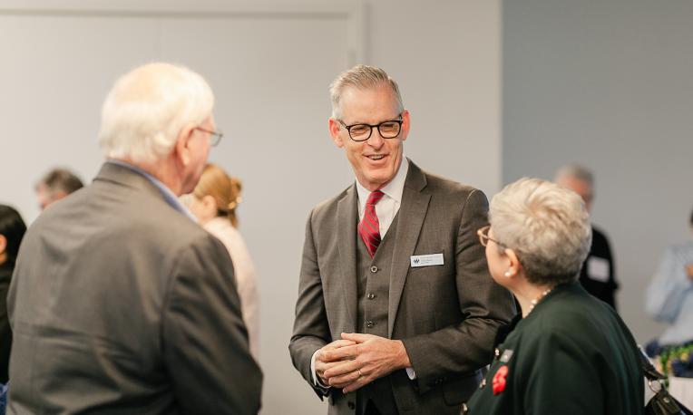 Dr. Todd Martin talking with people