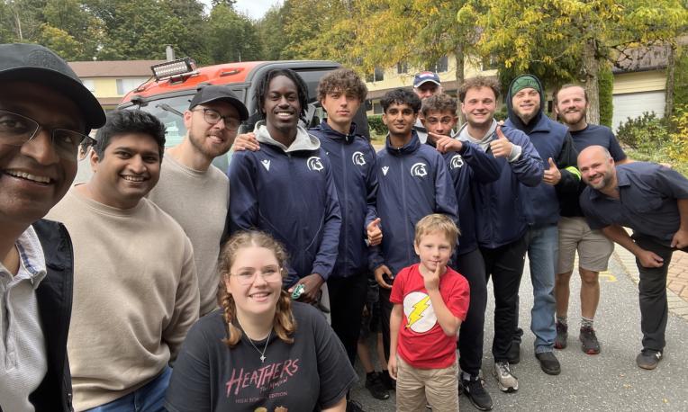 Group of people taking a selfie outside