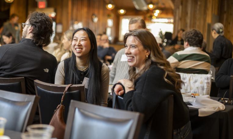 People in a room smiling 
