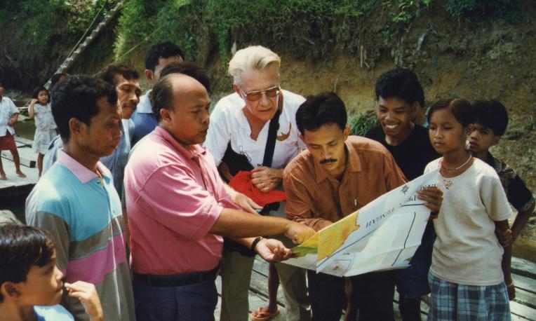 Men standing in front of map