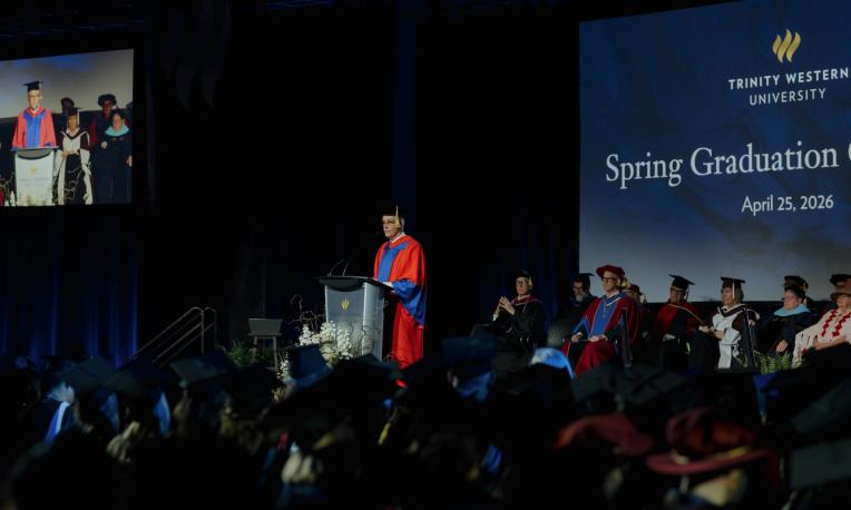 Dr. W. Robert Wood standing to give his commencement address