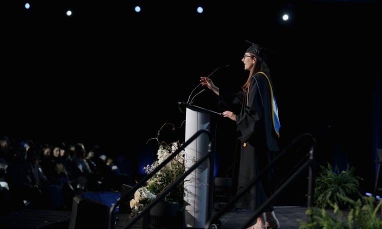 Jenessa Butler speaking at graduation ceremony