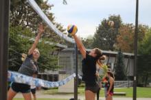 students playing volleyball