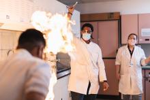 student doing experiment with fire