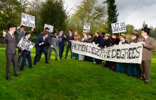 students gathered with banners to protest