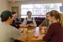 students playing cards at a table