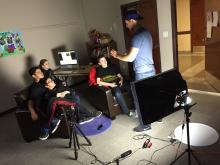 kids learning how to use film equipment