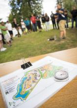people doing a team building activity together with a map in the foreground