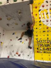 man on bouldering wall